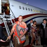 king mswati with a luxurious flight and background